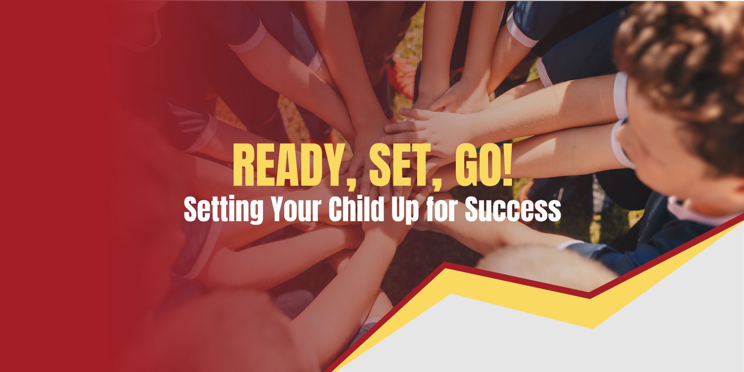 Children's hands stacked together, symbolizing teamwork.