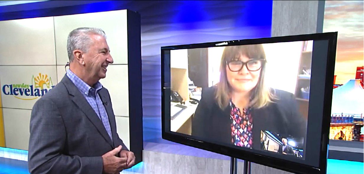 Adult male looking at a screen with an adult female on a video call.