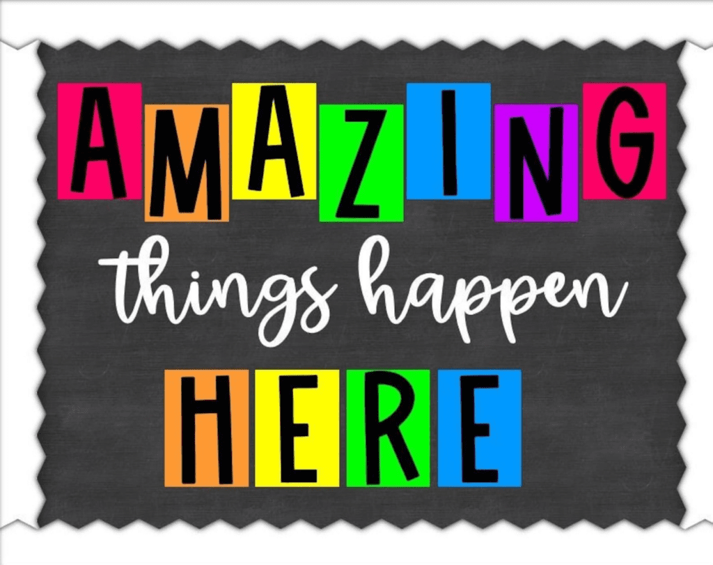 Colorful sign: "AMAZING things happen HERE."