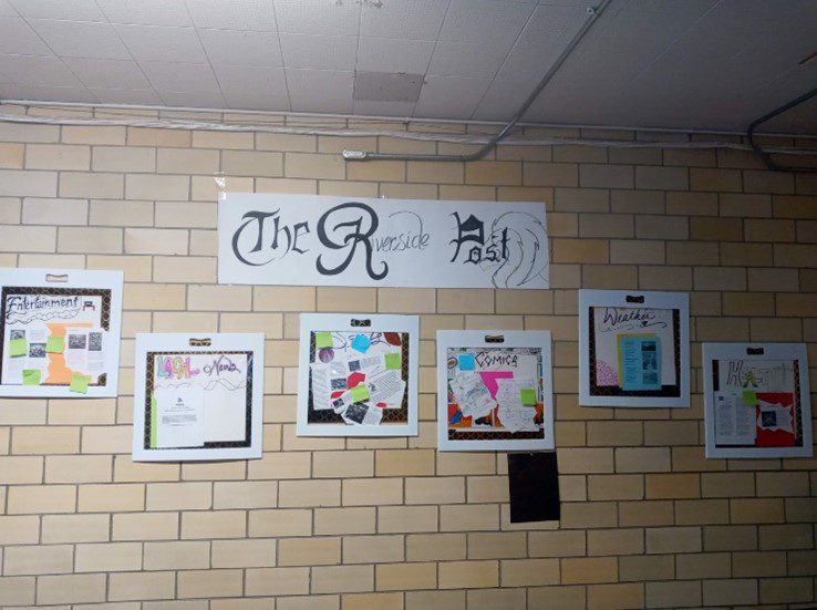 School newspaper display "The Riverside Post" with news sections.