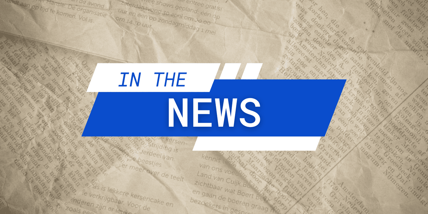 A banner with "IN THE NEWS" over a newspaper background.