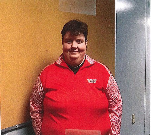Adult in red shirt with "FOUNDATION ACADEMY" logo.