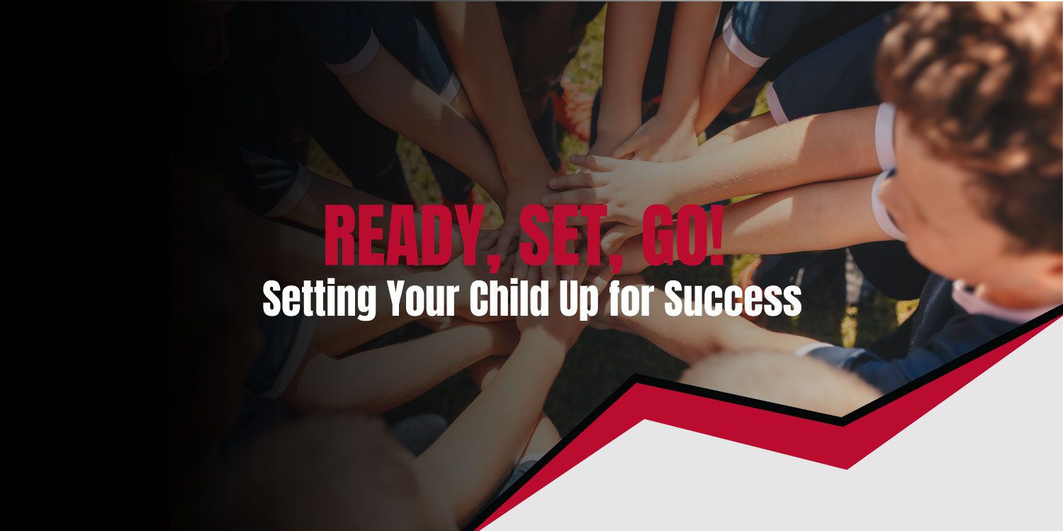 Children's hands stacked together, symbolizing teamwork.