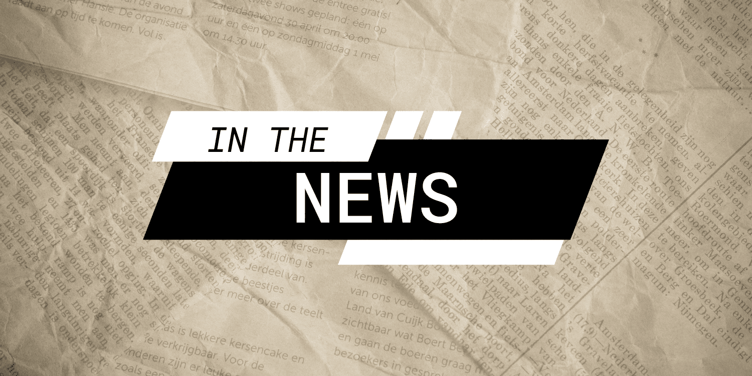Graphic with "IN THE NEWS" over a newspaper background.