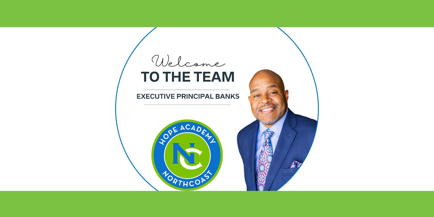 Man in suit smiles next to a logo and welcome text.
