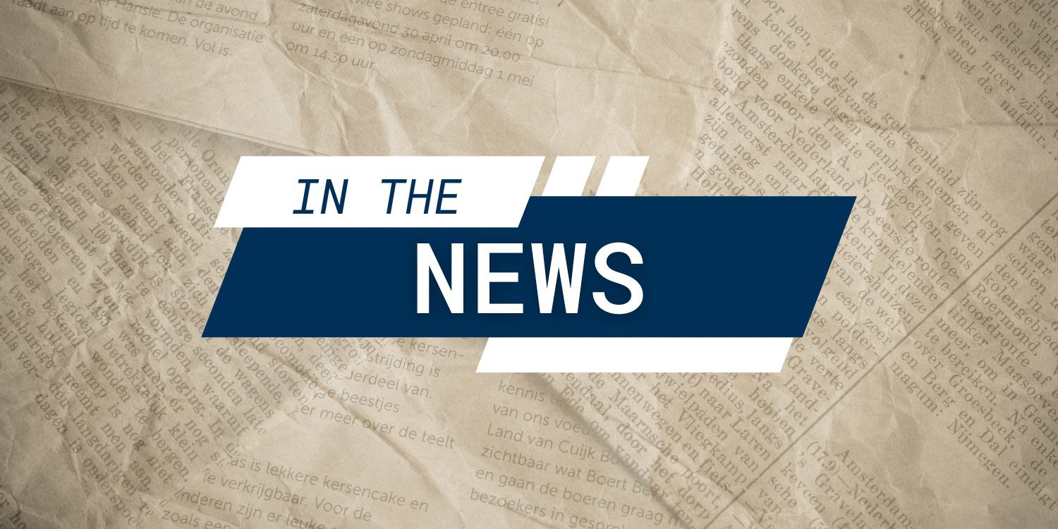 Graphic overlay "IN THE NEWS" on newspaper.