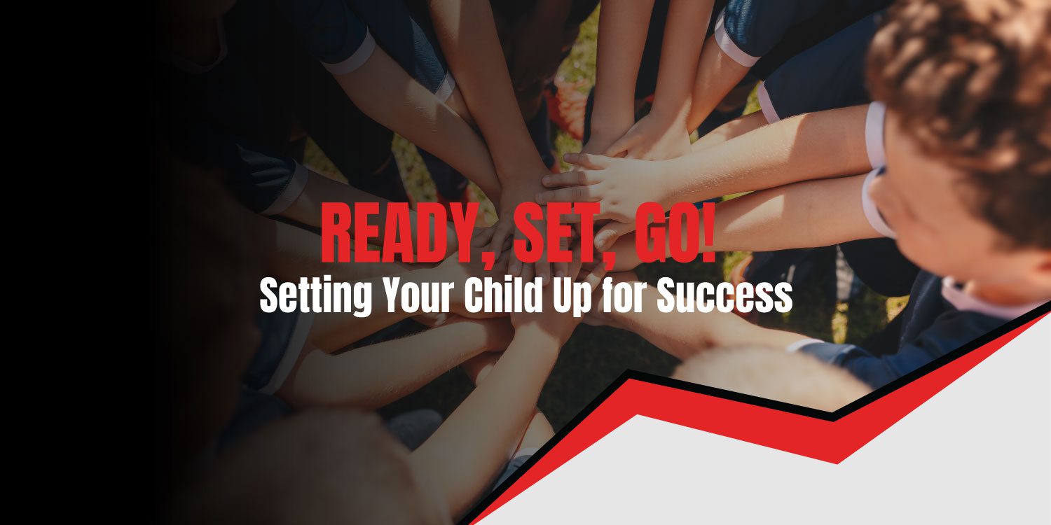 Children's hands stacked together in a circle, symbolizing teamwork.