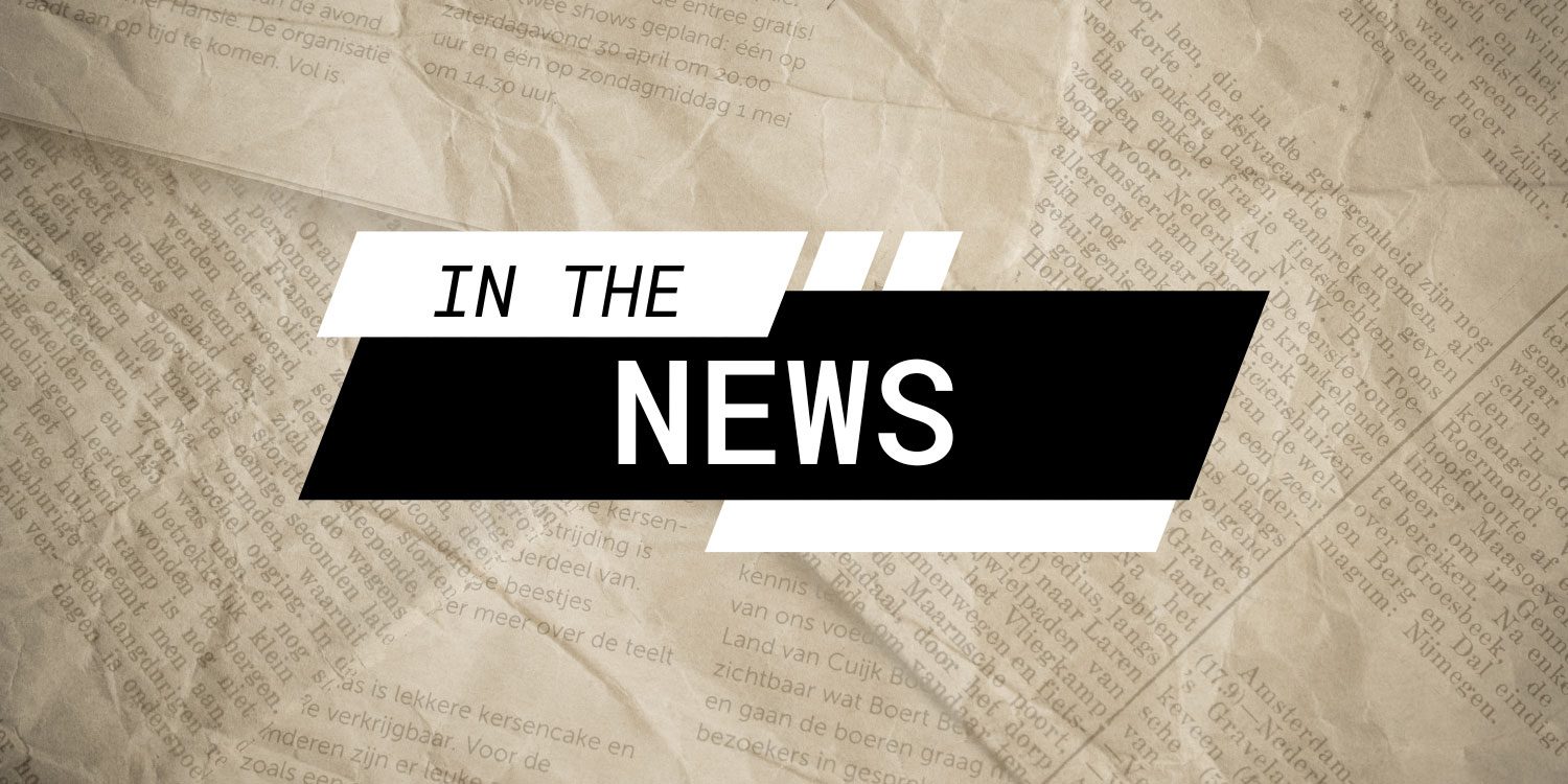 'IN THE NEWS' text over crumpled newspaper.