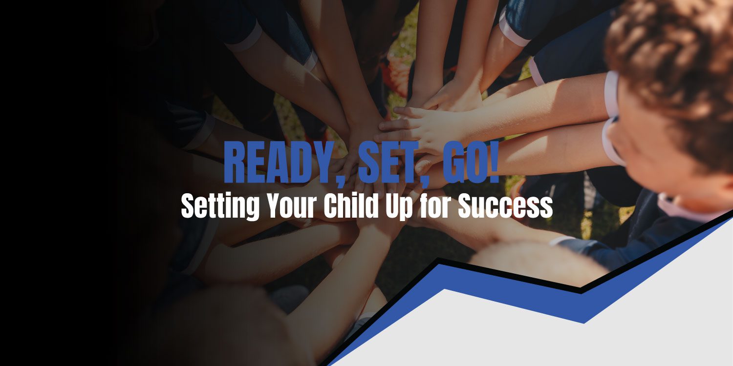 Children's hands stacked together, symbolizing teamwork.