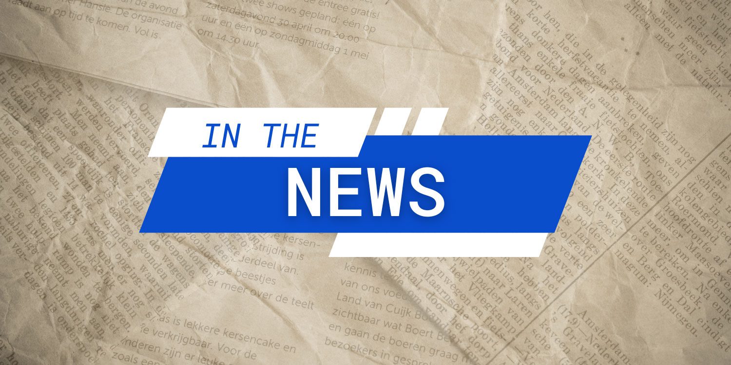Digital graphic "IN THE NEWS" over newspaper.